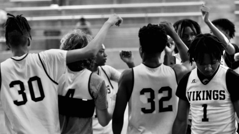 a group of young men standing next to each other